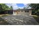 View of home exterior featuring a large backyard patio, great for entertaining and gatherings at 2818 Dellwood Dr, Orlando, FL 32806