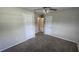 Comfortable bedroom with carpeted floors, ceiling fan, and access to an ensuite bathroom at 2818 Dellwood Dr, Orlando, FL 32806