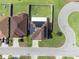 Aerial view of a home with solar panels, a driveway, a backyard, and situated on a cul-de-sac at 3125 Kearns Rd, Mulberry, FL 33860