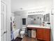 Well-lit bathroom with a shower-tub combo, white vanity, and modern fixtures at 3125 Kearns Rd, Mulberry, FL 33860