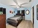 Bedroom featuring a ceiling fan, neutral walls, and black out curtains at 3125 Kearns Rd, Mulberry, FL 33860