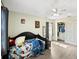 Bedroom with a light green wall, ceiling fan, closet and natural light from the window at 3125 Kearns Rd, Mulberry, FL 33860