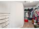 Walk-in closet with laminate wood flooring, ample hanging space and shelving, perfect for organization at 3125 Kearns Rd, Mulberry, FL 33860