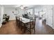Open-concept dining room adjacent to the living room, filled with natural light at 3125 Kearns Rd, Mulberry, FL 33860