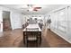 Open dining room with hardwood floors, white walls, and backyard view at 3125 Kearns Rd, Mulberry, FL 33860