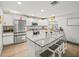 Bright kitchen with stainless steel appliances, granite countertops, and island with seating at 3125 Kearns Rd, Mulberry, FL 33860
