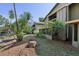 Backyard view showing lush greenery with waterside homes in the background at 4836 Pebble Beach Dr, Orlando, FL 32811