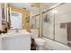 Bathroom featuring a mirror, vanity, toilet, and shower with sliding glass doors at 4836 Pebble Beach Dr, Orlando, FL 32811