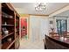 Dining area showcasing tile floors, chandelier lighting, and a view into the adjacent pantry at 4836 Pebble Beach Dr, Orlando, FL 32811