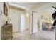 Bright entryway with tile flooring, white doors, and a view into an adjacent bathroom at 4836 Pebble Beach Dr, Orlando, FL 32811