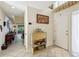 Bright foyer with an open floor plan view into the living area and tile flooring at 4836 Pebble Beach Dr, Orlando, FL 32811