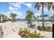 Resort-style community pool area with a splash pad, seating, and lush landscaping offering a relaxing oasis at 6889 Wilson Hammock Ave, Groveland, FL 34736