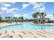 Large community pool with splash pad and seating areas, perfect for Gathering fun and relaxation at 6889 Wilson Hammock Ave, Groveland, FL 34736