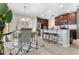 Chic dining area with modern furnishings, open to the kitchen with breakfast bar at 6889 Wilson Hammock Ave, Groveland, FL 34736