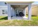 Relaxing outdoor patio with a seating area and a grill, perfect for entertaining at 6889 Wilson Hammock Ave, Groveland, FL 34736