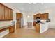 Large kitchen with an island, granite counters, stainless appliances, and ample cabinet space at 13708 Old Dock Rd, Orlando, FL 32828