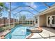 Relaxing screened-in pool and spa with brick accents, offering a private outdoor oasis at 13708 Old Dock Rd, Orlando, FL 32828