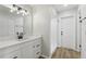Bathroom featuring a modern vanity, white cabinets, and stylish fixtures at 2791 Citron Dr, Longwood, FL 32779