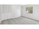 Bedroom featuring large window with natural light and closet with bi-fold doors at 2791 Citron Dr, Longwood, FL 32779
