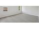 Clean, carpeted bedroom featuring neutral walls, baseboard trim, and two windows for natural light at 2791 Citron Dr, Longwood, FL 32779