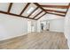 Large bonus room with skylights and wood-look floors, open to a white kitchen at 2791 Citron Dr, Longwood, FL 32779