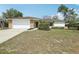 Charming single-story home with brick accents, well-maintained lawn, and attached two-car garage at 2791 Citron Dr, Longwood, FL 32779