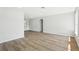 Spacious room featuring wood-look flooring, fresh paint, and updated lighting fixtures at 2791 Citron Dr, Longwood, FL 32779