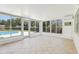 Bright sunroom with tiled floor and a view of the pool at 2791 Citron Dr, Longwood, FL 32779