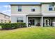Backyard features a covered patio and lawn at 3550 Rodrick Cir, Orlando, FL 32824