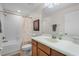 Well-lit bathroom features a tub and shower combination with a vanity and neutral decor at 3550 Rodrick Cir, Orlando, FL 32824