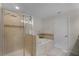 Elegant bathroom features glass shower, soaking tub, and tiled walls at 3550 Rodrick Cir, Orlando, FL 32824