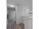 Bright upper hallway with wood floors and white trim details at 3550 Rodrick Cir, Orlando, FL 32824