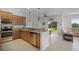 Kitchen with stainless steel appliances, granite countertops, and a breakfast bar opening to the dining area at 3550 Rodrick Cir, Orlando, FL 32824
