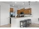Bright kitchen features stainless steel appliances, granite countertops, and bar stool seating at 3550 Rodrick Cir, Orlando, FL 32824