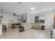 Bright living space with tile flooring, dining area, large sectional sofa and a sliding glass door at 3550 Rodrick Cir, Orlando, FL 32824