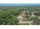 Sprawling property with mature trees, lush landscaping, and a well-maintained home and multiple storage buildings at 4145 Willow Oak Rd, Mulberry, FL 33860