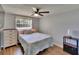 Comfortable bedroom featuring a ceiling fan and natural light from the window at 4145 Willow Oak Rd, Mulberry, FL 33860