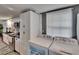 Laundry area with cabinetry, washer, dryer, and access to the updated kitchen at 4145 Willow Oak Rd, Mulberry, FL 33860
