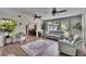 Comfortable living room with ample natural light and stylish furnishings, connected to dining area at 4145 Willow Oak Rd, Mulberry, FL 33860