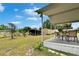 Relaxing porch view with outdoor furniture and scenic backyard, perfect for outdoor gatherings at 4145 Willow Oak Rd, Mulberry, FL 33860