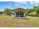 Relax on this spacious screened porch with a seating area, perfect for enjoying the outdoors at 4145 Willow Oak Rd, Mulberry, FL 33860