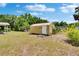 Backyard with a shed for extra storage and ample space for outdoor activities at 4145 Willow Oak Rd, Mulberry, FL 33860