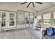 Cozy sunroom featuring a bar, rocking chair, wicker sofa, and natural light at 4145 Willow Oak Rd, Mulberry, FL 33860