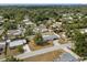 Aerial view of a quaint neighborhood featuring well-maintained homes and lush greenery at 455 W Plumosa St, Bartow, FL 33830