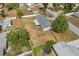 A tranquil residential neighborhood featuring a well-maintained single-story home with a spacious yard at 455 W Plumosa St, Bartow, FL 33830