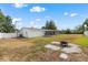 Spacious backyard featuring a patio and a fire pit, perfect for outdoor gatherings at 455 W Plumosa St, Bartow, FL 33830