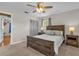 Serene bedroom with wood furniture, neutral tones, and cozy carpet flooring at 455 W Plumosa St, Bartow, FL 33830