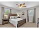 Inviting bedroom with a wooden bed frame, bedside tables, and natural light at 455 W Plumosa St, Bartow, FL 33830