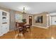 Cozy dining room with hardwood floors, traditional furnishings, and natural light at 455 W Plumosa St, Bartow, FL 33830
