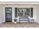 Welcoming front porch with brick flooring, bench seating, and a charming entryway at 455 W Plumosa St, Bartow, FL 33830